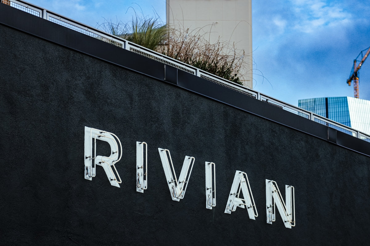 The rivian logo is displayed on a building.